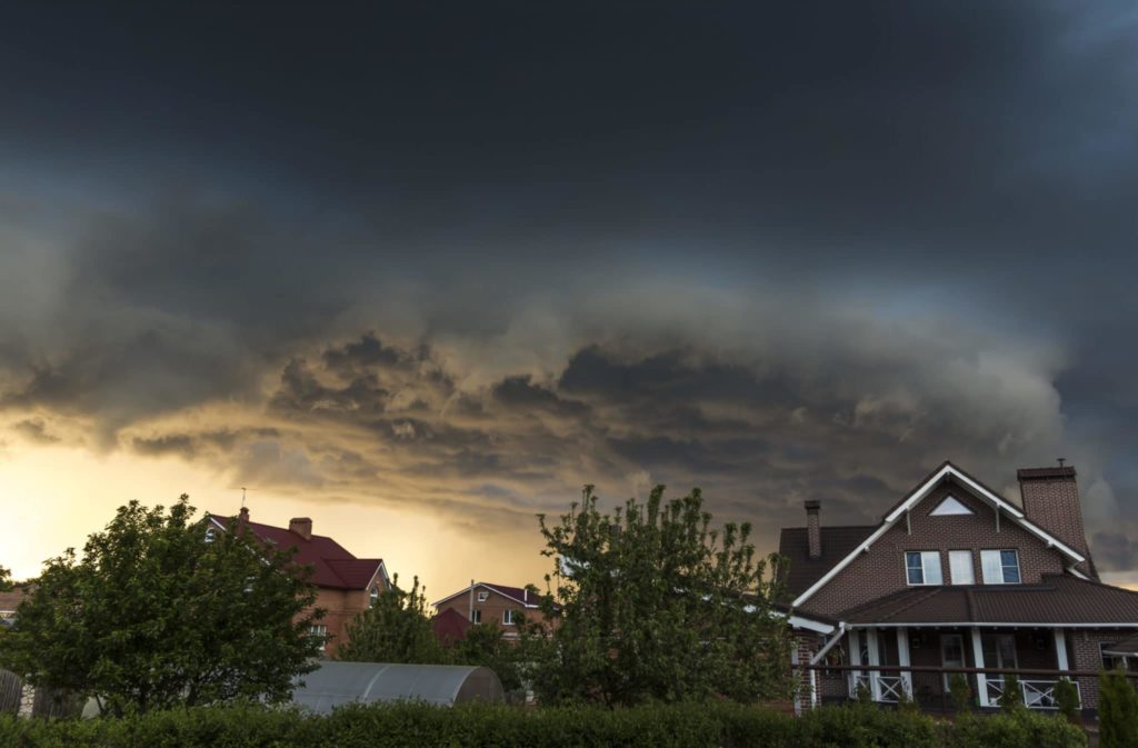 Summer storm clouds over homes