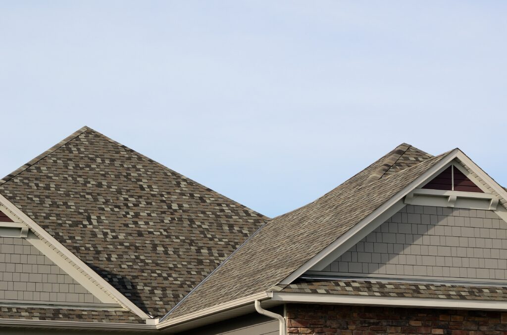 Asphalt Shingles on a Hip Roof with Gable Dormers on a Residential House