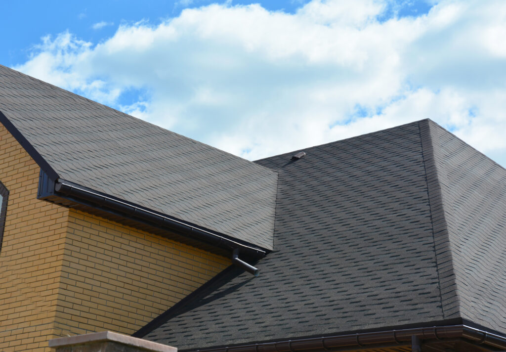 A photo showing a house with a combination of hip and gable roof structures, illustrating the differences between hip roof vs gable roof.